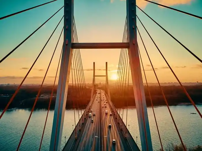 Nie przegap Fototapeta Beautiful Panoramic Aerial Drone View To Cable-Stayed Siekierkowski Bridge Over The Vistula River And Warsaw City Skyscrapers, Poland In Gold Red Autumn Colors In November Evening At Sunset