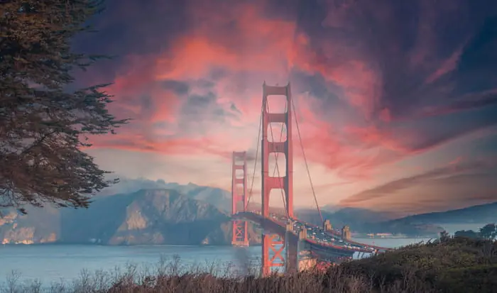 Super okazja Fototapeta Beautiful View Of Golden Gate Bridge In Background Of Mountains During Sunset